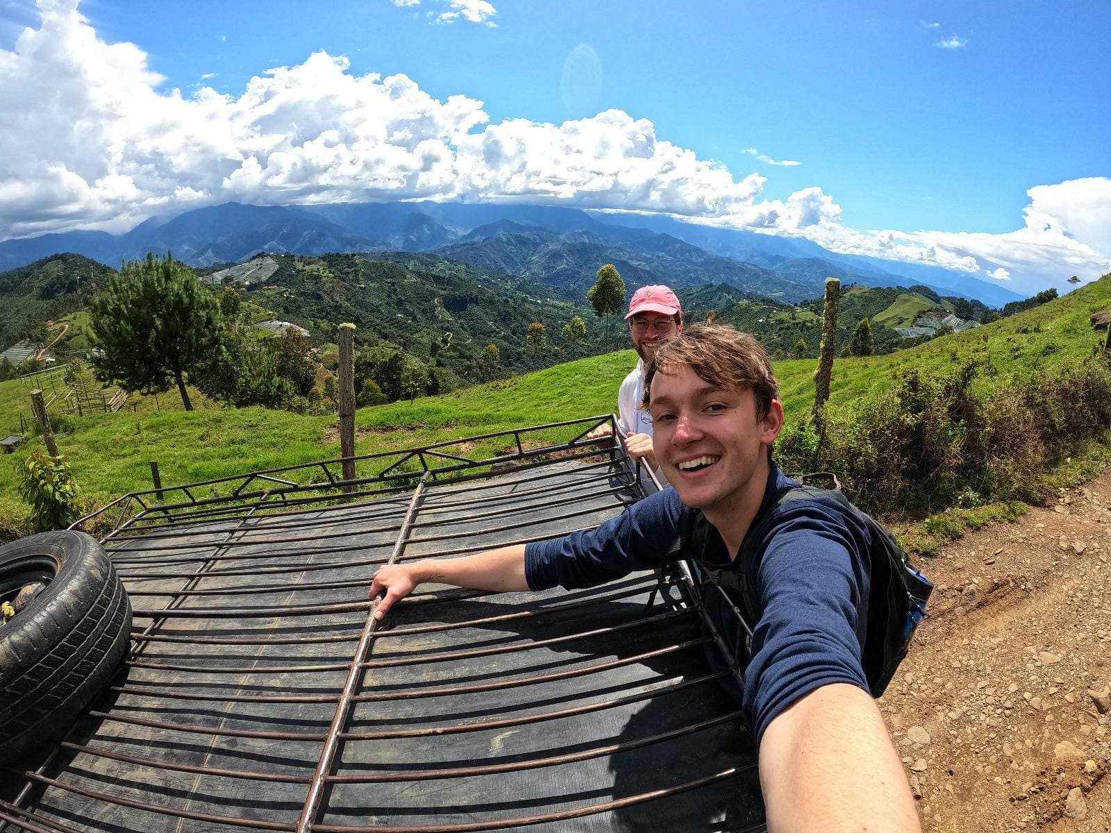 An image of me on the back of a truck in the Colombian mountains
